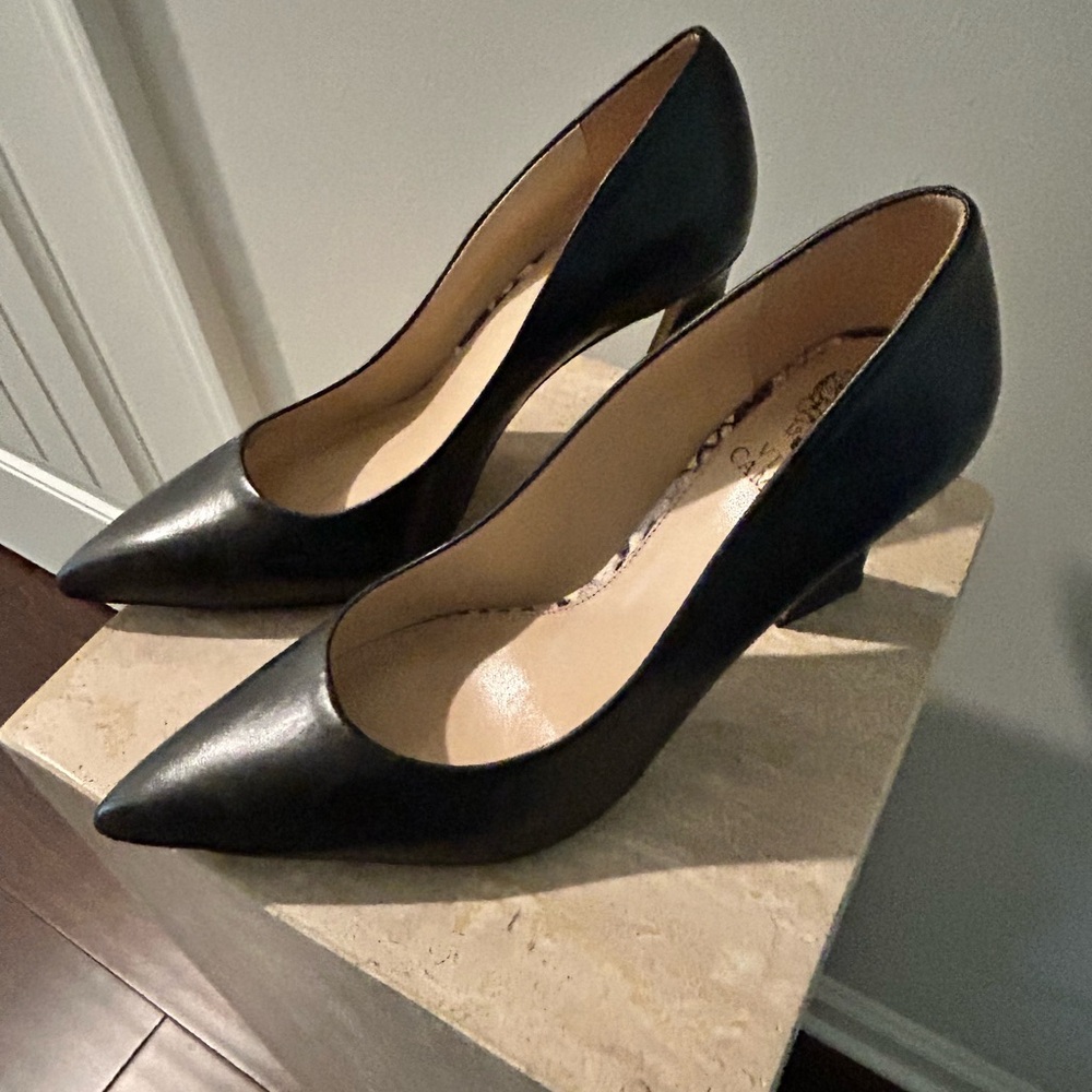 Black Vince Camuto pumps, worn several times are in good condition.
